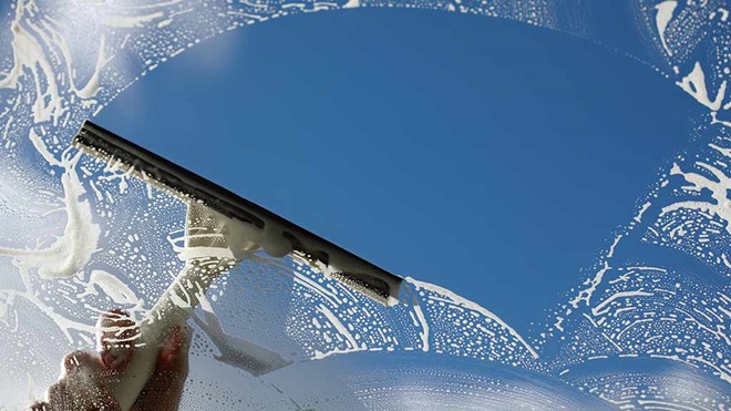 cleaning window with a squeegee
